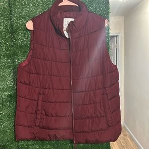 A burgundy vest winter time color